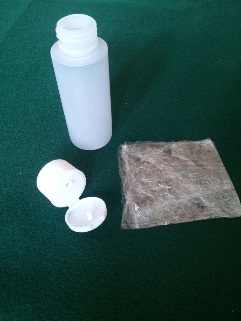 Fold the plastic wrap into a small square.