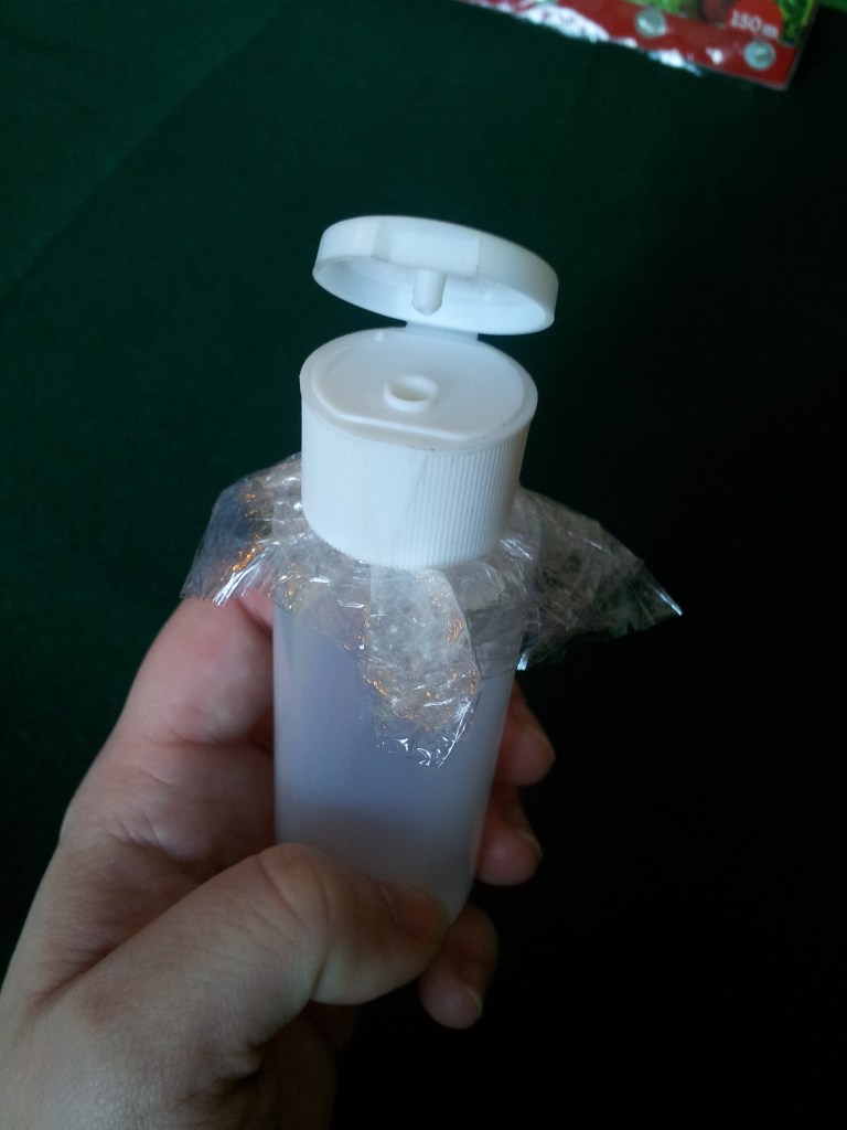 Screw the cap of the bottle back on, gently but firmly.