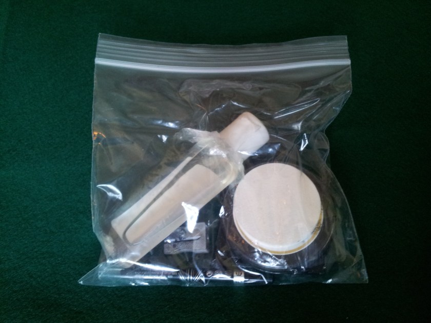 Bottle of isopropanol, 1 flat makeup sponge, 1 paint pot, 1 tiny mirror, 1 waterproof eyeliner, 1 tiny pencil sharpener (optional).